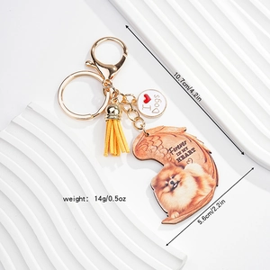 Detail of dog memorial keychain with leather tassel and heart-shaped pendant