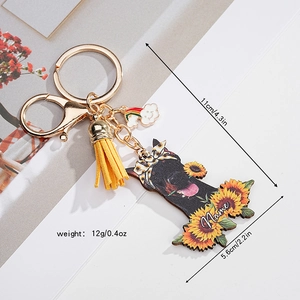 Custom dog silhouette keychain with sunflower and yellow tassel on white background