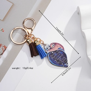 Detailed sloth acrylic keychain with colorful tassels and golden lobster clasp closure