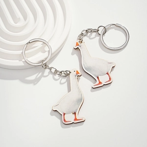 Set of two cute white goose wooden keychains with realistic patterns and metal rings
