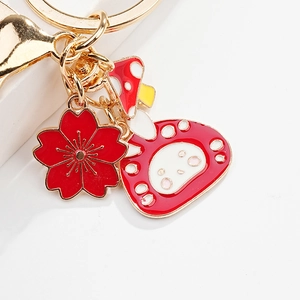 Cute cartoon rabbit enamel keychain with golden metal chain featuring cherry blossom and mushroom