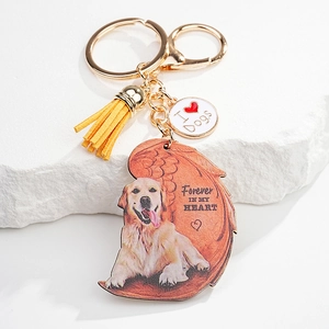 Golden Retriever memorial keychain with angel wing pendant and yellow leather tassel detail