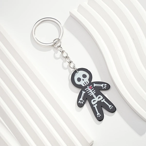 Detail of creative skeleton keychain with red heart and silver metal ring accessory