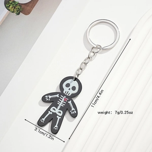 Detail view of acrylic skeleton keychain with red heart and specific size measurements