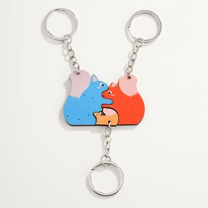 Cartoon squirrel puzzle keychains in blue, red and orange colors for family fun