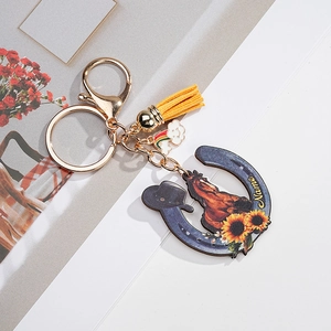 Custom horseshoe keychain with brown horse, sunflower print, and yellow leather tassel