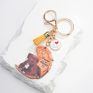 Memorial dog acrylic keychain with angel wings and leather tassel on white stone