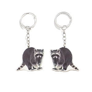 Set of two realistic raccoon wooden keychains with silver metal rings and lifelike animal art