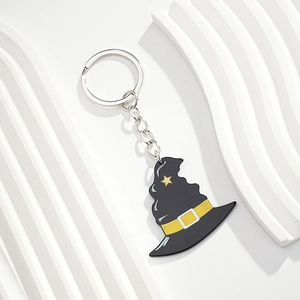Detail of creative Halloween wizard hat keychain with star pattern and silver metal ring