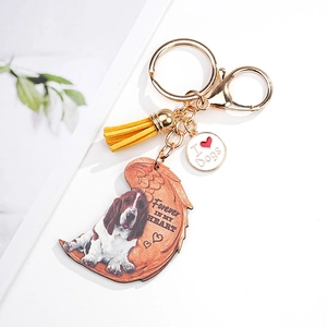 Detail of Basset Hound memorial keychain with golden tassel and Forever in My Heart text