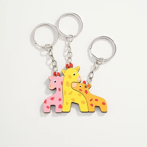 Three-piece giraffe parent-child wooden keychains with colorful polka dot patterns