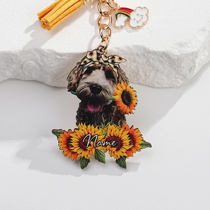 Detailed view of custom dog acrylic keychain with sunflower, leather tassel and rainbow charm