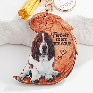 Detail of Basset Hound wing charm with yellow tassel and Forever In My Heart text