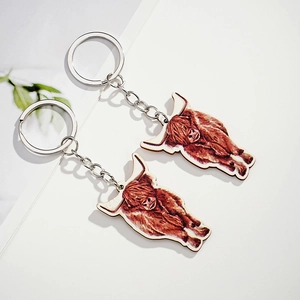 Creative wooden highland cow keychains with realistic painted fur texture and metal ring