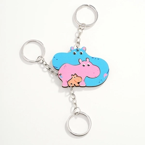 Three-piece family hippo keychain set with creative puzzle design in blue pink and brown