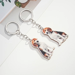 Detail of cute realistic Beagle dog wooden keychains with durable silver metal rings