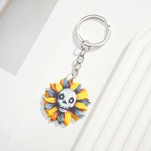 Detailed close-up of a creative gothic sunflower skull keychain with silver metal ring