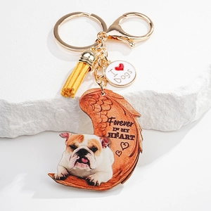 Detailed view of British Bulldog keychain with leather tassel and memorial heart pendant