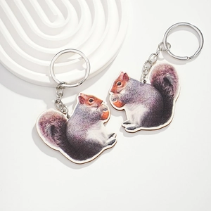 Set of two creative wooden squirrel keychains with realistic animal prints and metal rings