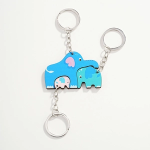 Driedelige houten olifant puzzel sleutelhanger set in blauw, cyaan en roze voor tassen