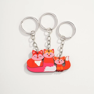 Cute red fox family wooden keychain set for bags and gifts, featuring three cartoon foxes