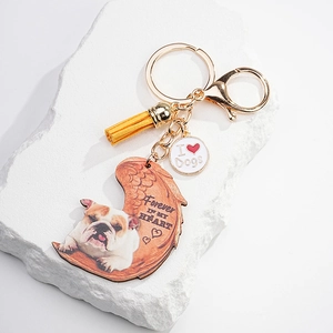 Detailed bulldog memorial acrylic keychain with angel wings and yellow fiber tassel