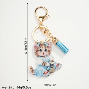 Cute cartoon cat keychain with blue dress, gold metal clasp and tassel, 12.5cm height
