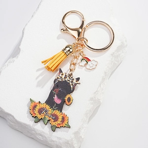 Customized sunflower dog keychain with yellow leather tassel and golden lobster clasp detail
