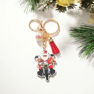 Detail of Santa Claus motorcycle keychain with red tassel and starry crystal ball ornament