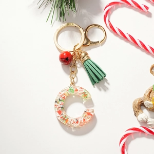 Detailed Christmas letter C resin keychain with miniature snowman, red bell and green tassel