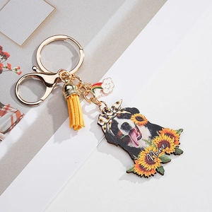Detailed macro view of Bernese Mountain Dog sunflower keychain with name slot