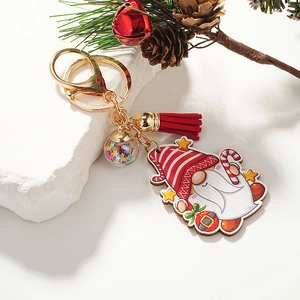 Porte-clés gnome de Noël avec sequins étoilés, gland rouge et accessoires festifs