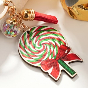 Rainbow lollipop keychain with red tassel and star-filled glass ball on golden ring