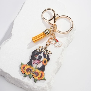 Detail of sunflower dog keychain with yellow leather tassel and gold lobster clasp