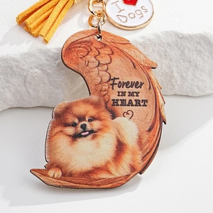 Detail of wooden Pomeranian keychain with leather tassel and Forever in my heart engraving