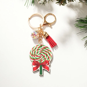 Detailed view of Christmas rainbow lollipop keychain with red tassel and sequins ball