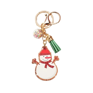 Creative Christmas snowman wooden keychain with green tassel and sparkling star-filled ball