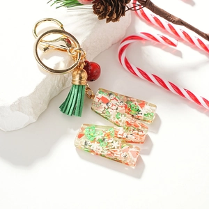 European Christmas resin keychain with snowman, tree motifs and festive green tassel
