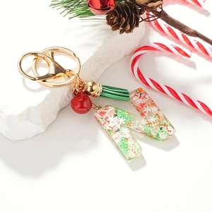 Porte-clés de Noël lettre N en résine avec bonhomme de neige, gland vert et clochette