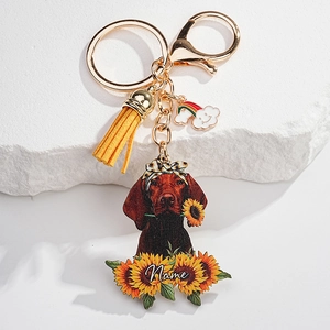 Detail of custom Vizsla dog keychain with yellow tassel and personalized name engraving