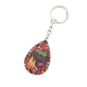 Halloween keychain with cauldron and skull patterns on drop-shaped acrylic pendant