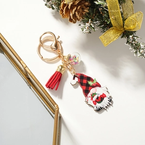 Christmas gnome keychain with red plaid hat, red tassel, and star sequin ball charm