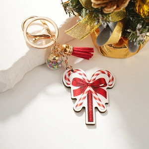 Christmas candy cane keychain with red bow, red tassel, and colorful star glass ball