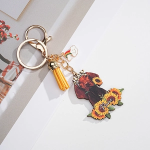 Custom dog keychain featuring a Vizsla with sunflowers and yellow leather tassel detail