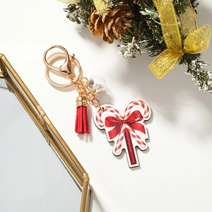 Christmas star keychain with candy cane, red silk tassel, and festive holiday decorations