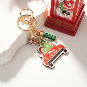 Christmas keychain featuring red truck pendant, green tassel, and a star filled glass ball