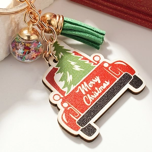 Christmas truck keychain with green tassel and sparkling star-filled glitter glass ball