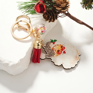 Christmas leopard print Santa Claus keychain with red tassel and gold metal ring charms