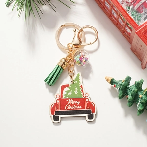 Christmas truck keychain with green tassel and sparkling star-filled glass ball detail