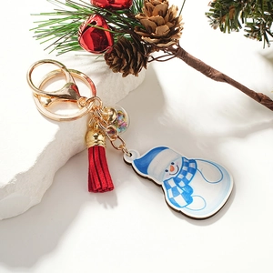 Festive wooden snowman keychain with blue scarf, red tassel and starry decorative ball charm